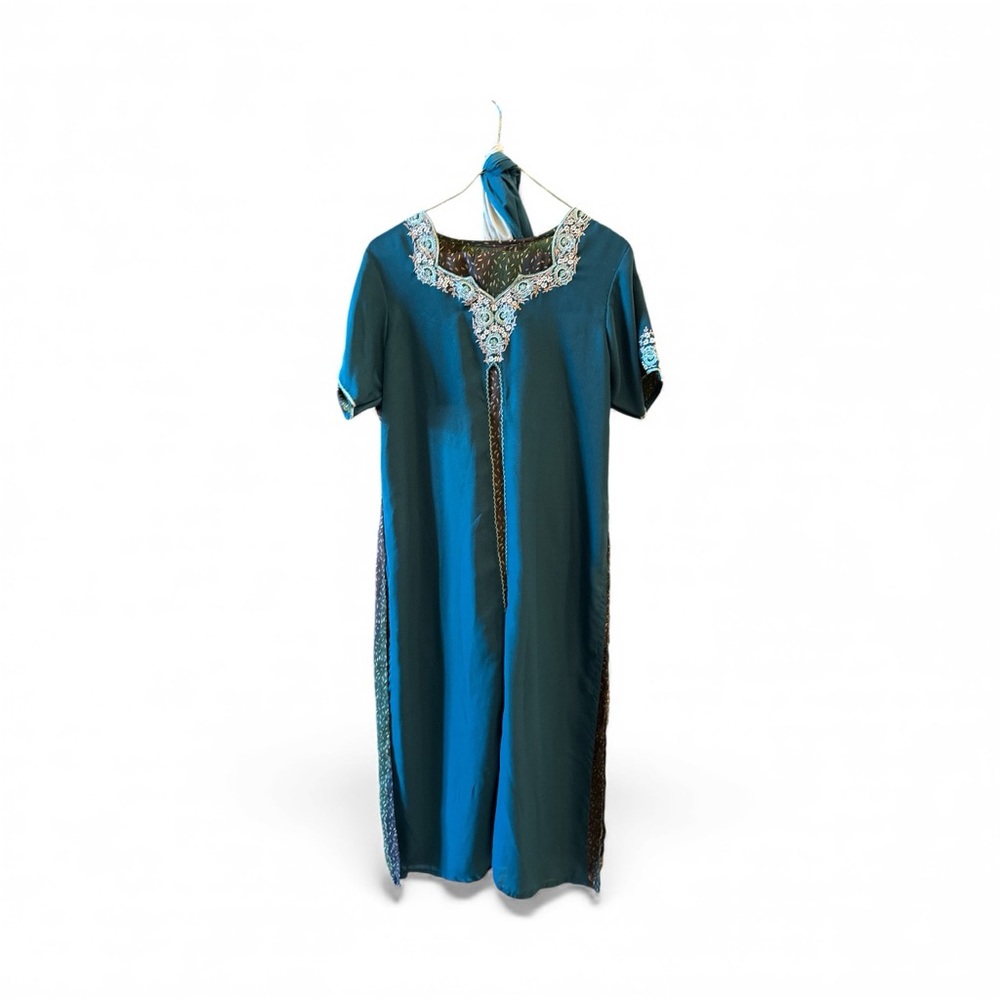 Teal Embroidered Pumjabi with cream and brown accents.